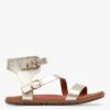 Ugg W SOLIVAN STRAP - Platte, Glanzende, Leren Sandalen | Goudkleurige